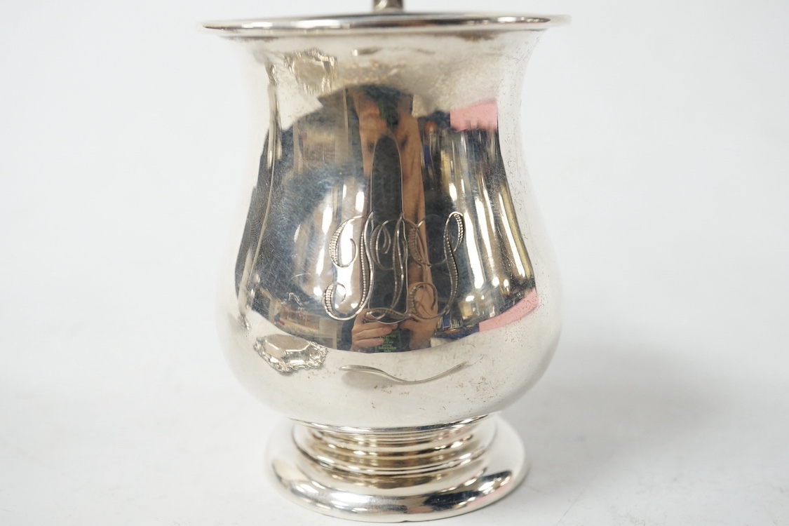 An Edwardian small silver baluster mug, Robert Pringle & Sons, Chester, 1906, 78mm, together with small silver trophy cup, a sterling pin tray and a silver condiment spoon. Condition - fair